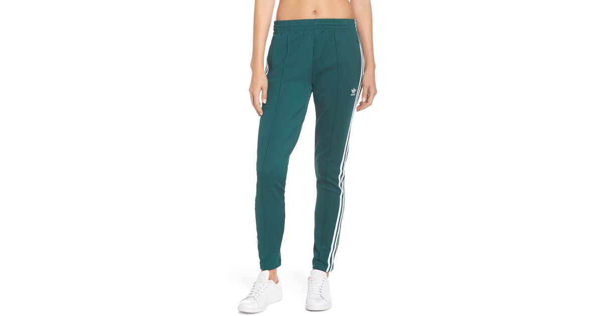 green adidas sst track pants