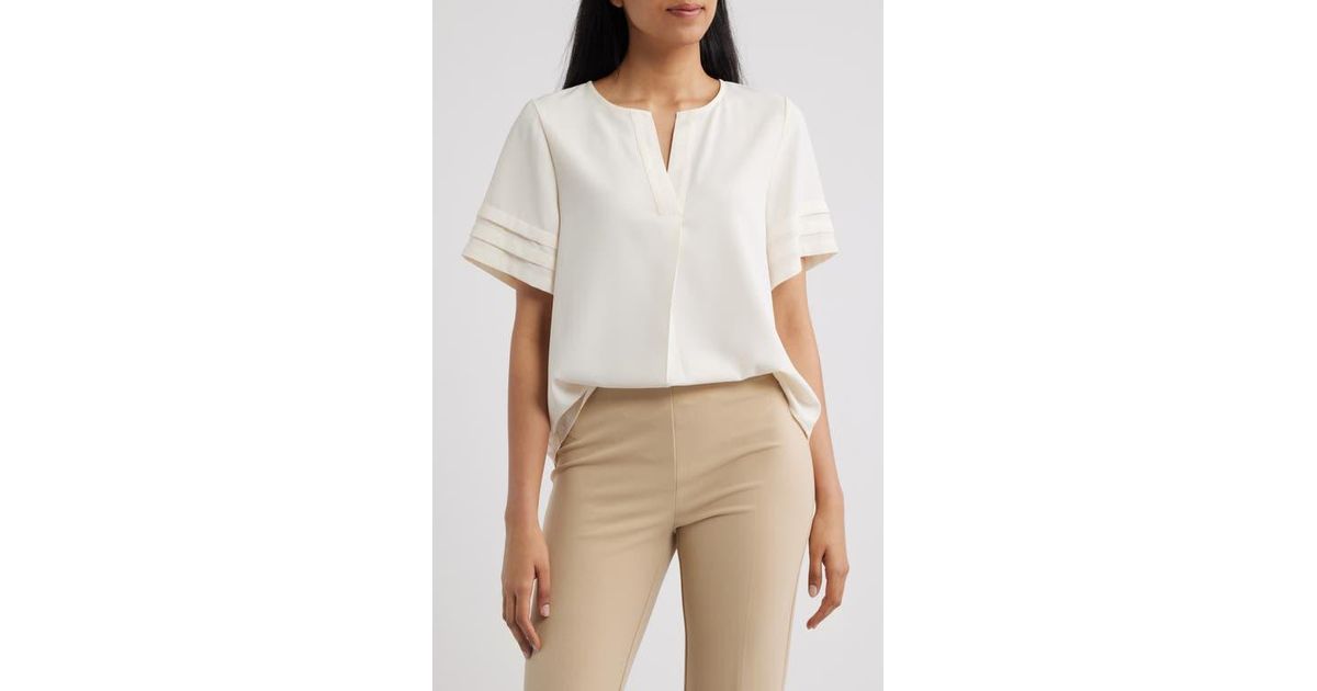 Round Split Neck Anne Klein Pleated Split Neck Top in White | Lyst