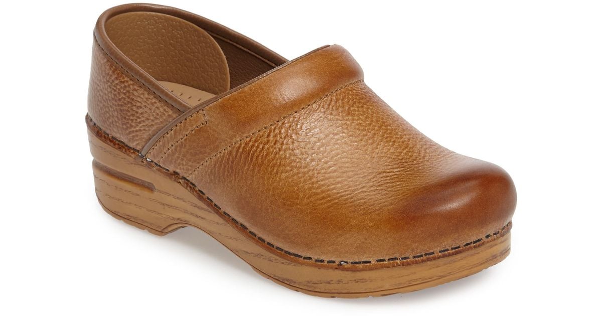 brown tooled dansko clogs