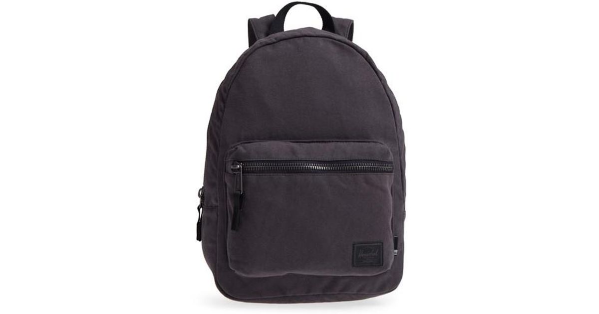 small black canvas backpack