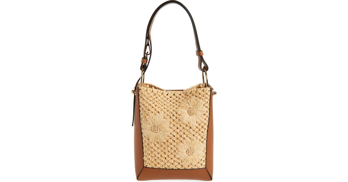 WANDER BUCKET BAG 23 IN NATURAL RAFFIA WITH LEATHER TRIM