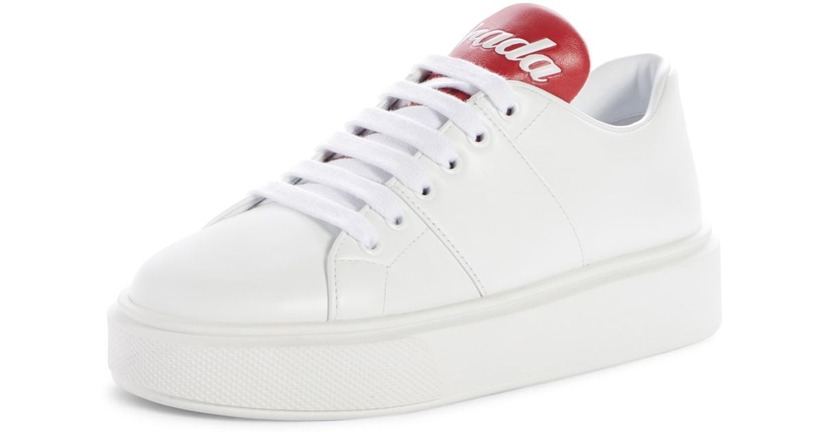 prada white sneakers with red stripe