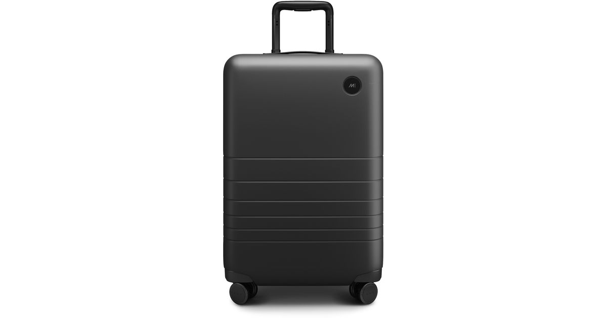 Monos 23-inch Carry-on Plus Spinner luggage in Black | Lyst