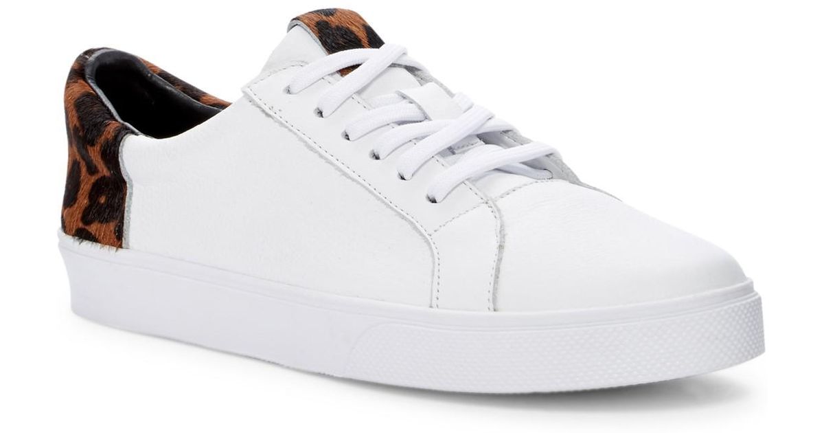 white tennis shoes with leopard print