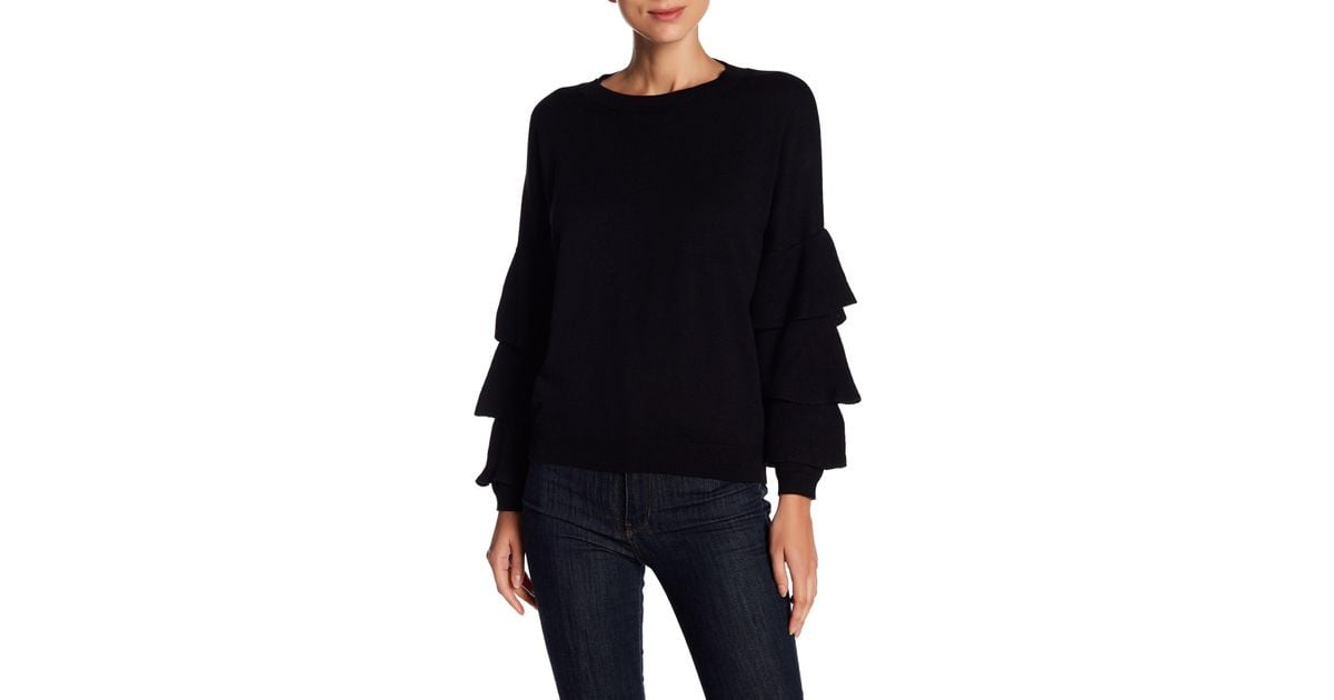 black sweater with ruffle sleeves