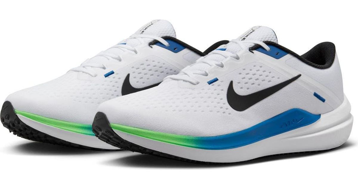 nike running winflo trainers in black and blue