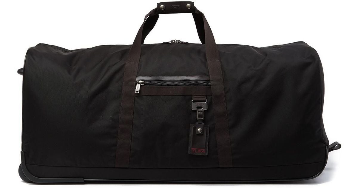 Tumi Bridgeway Collapsible Wheeled Duffel Bag in Black | Lyst