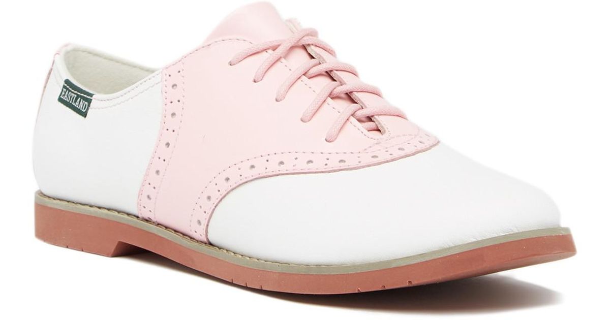 pink and white saddle shoes