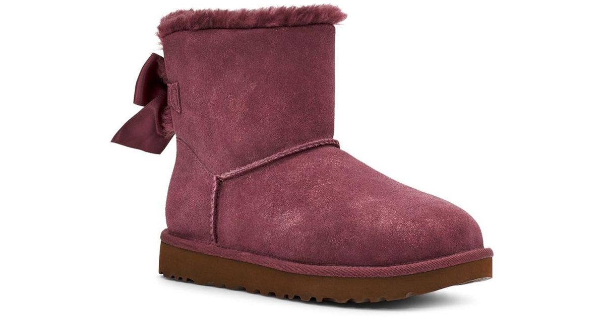 UGG Suede Mini Bailey Bow Glimmer Faux Fur Lined Boot In Wild Grape At ...