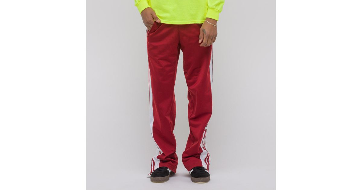 adibreak track pants red