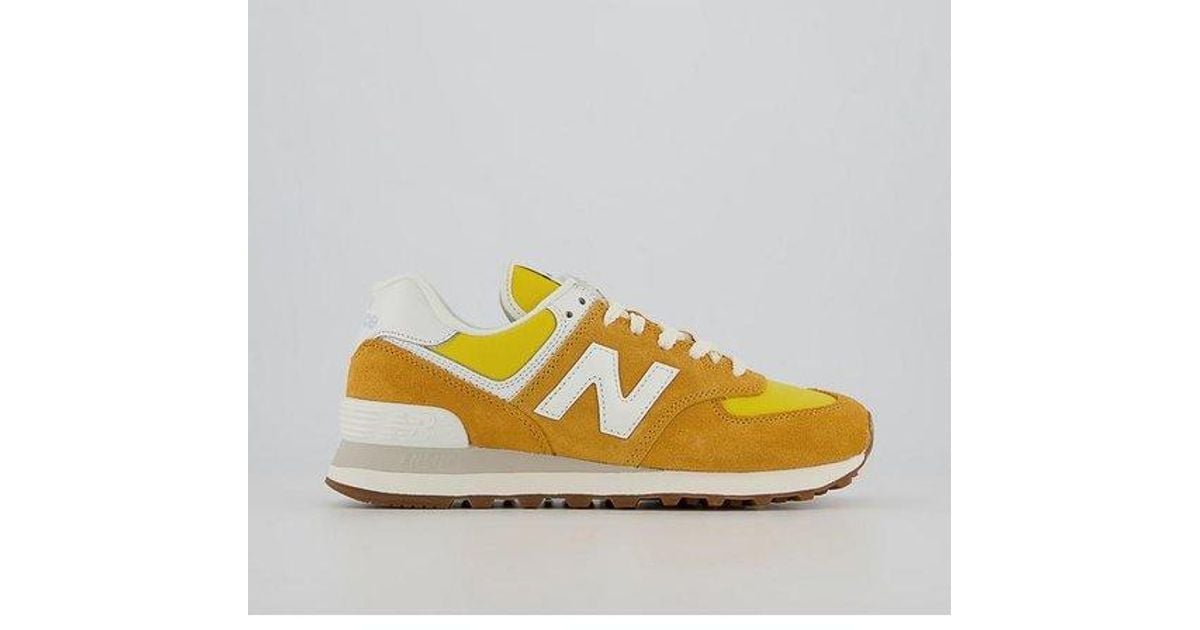 New Balance 574 Trainers in Yellow Lyst