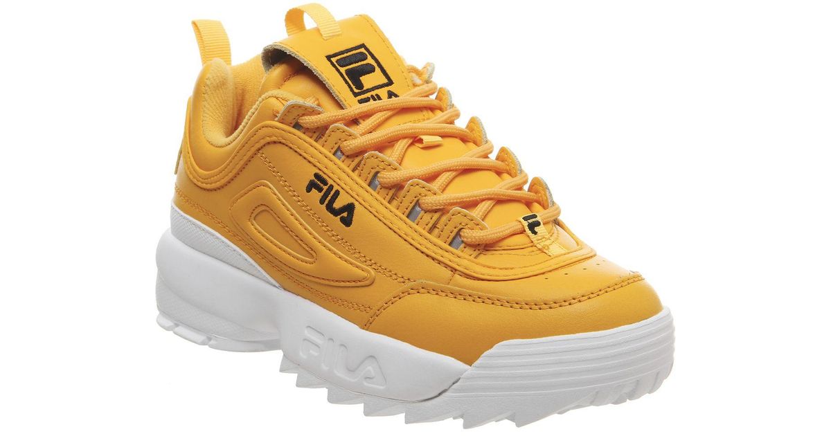 black and gold fila trainers