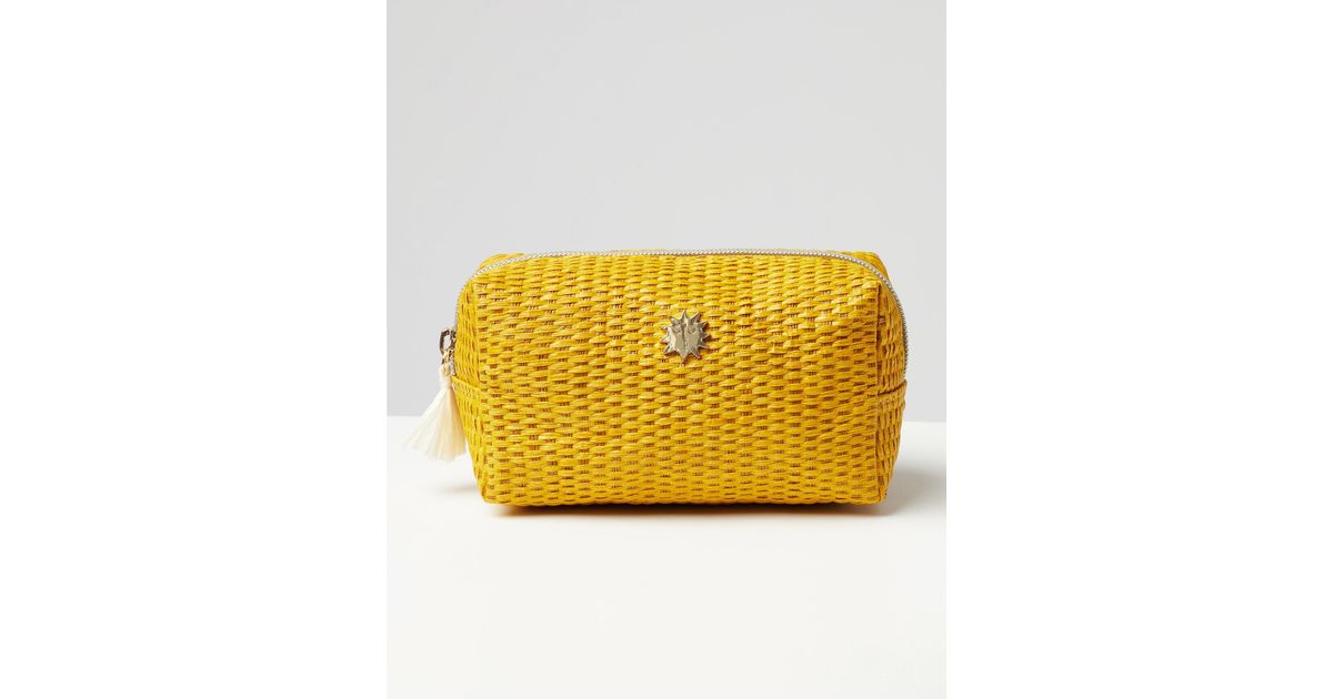 oliver bonas yellow purse