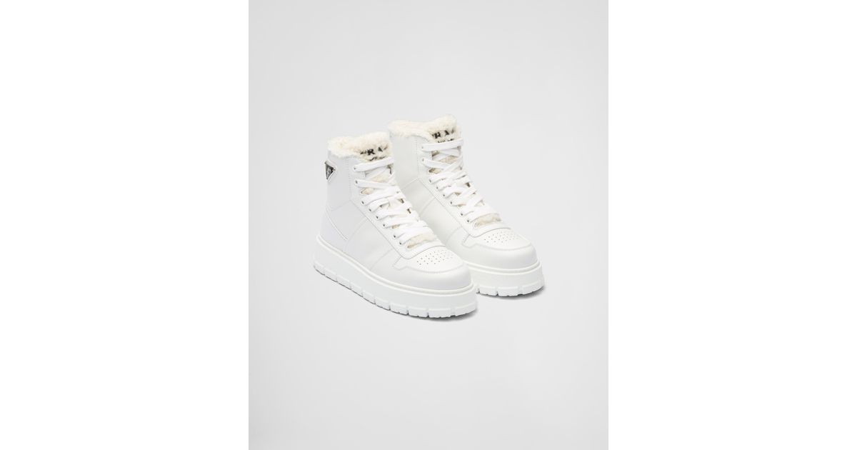 Prada Leather And Shearling High-top Sneakers in White | Lyst