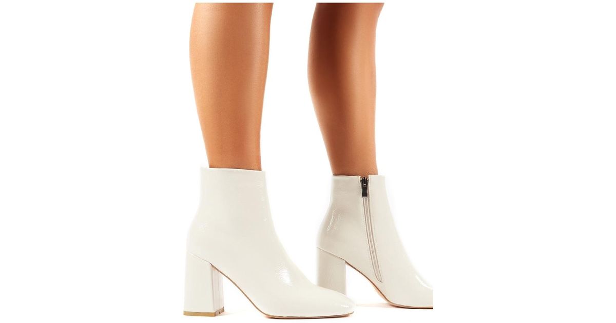 cream patent ankle boots