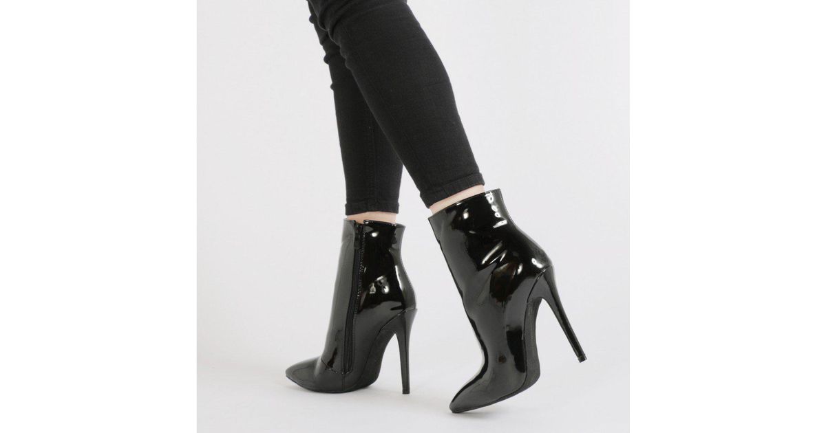 black patent pointed boots