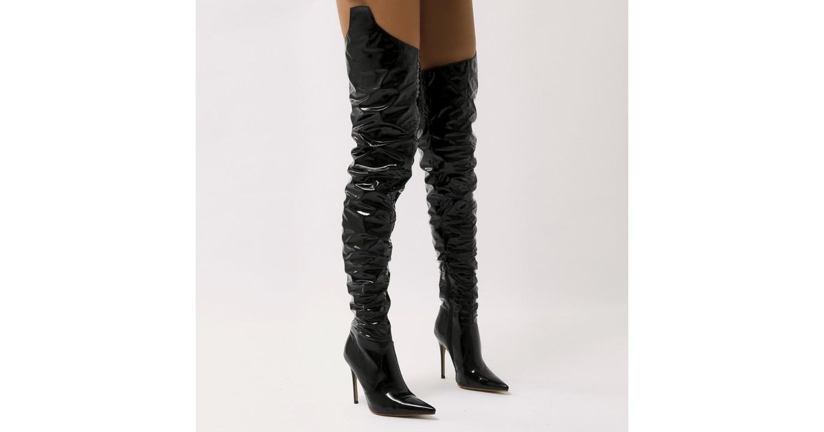 black vinyl knee high boots
