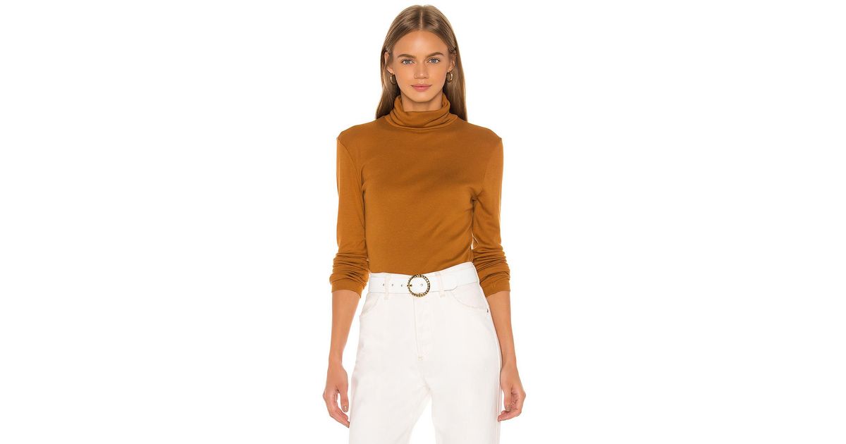 orange turtleneck outfit