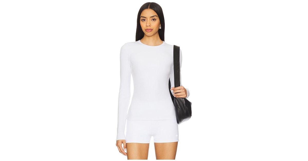Alo Yoga Ribbed Modal Long Sleeve Top in White | Lyst Australia