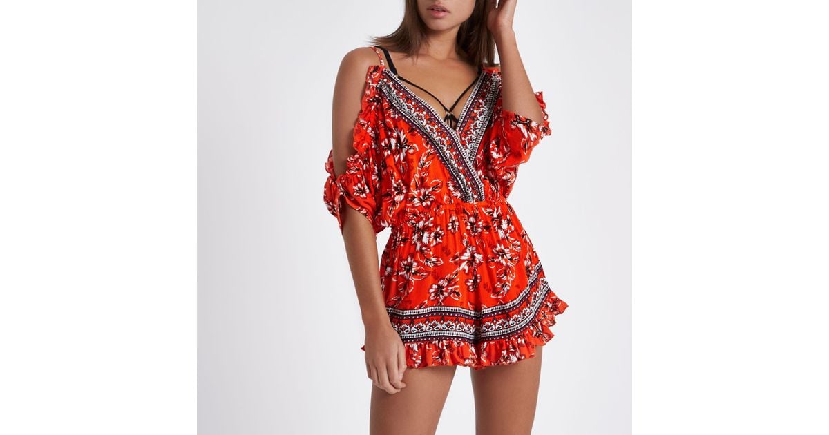 orange playsuit river island