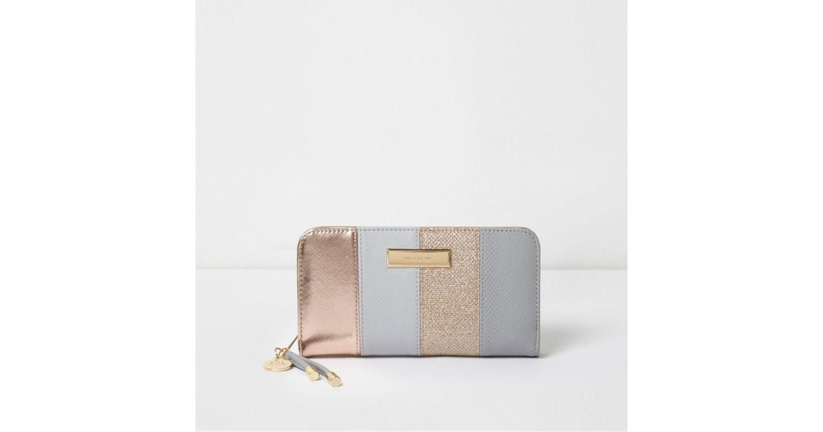 grey and rose gold purse