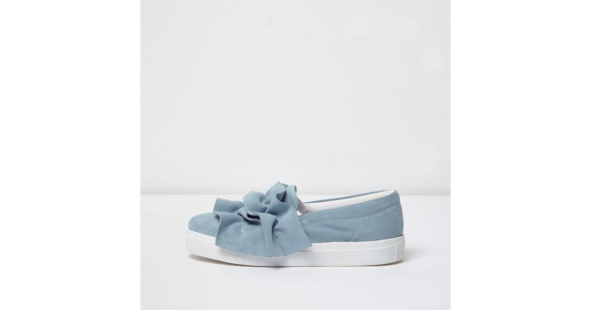 light blue plimsolls