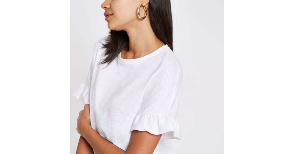 white shirt with frill sleeves