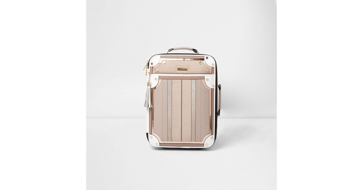 cream suitcase