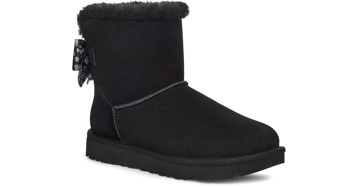 UGG Mini Bailey Bow Leopard Suede & Leather Classic Boot in Black | Lyst