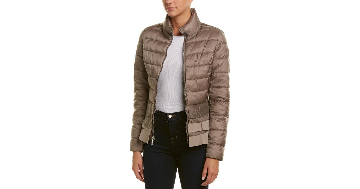 tahari zoey ruffle hem coat