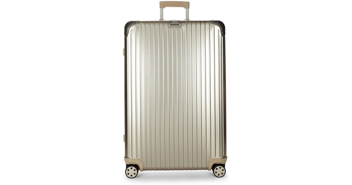 rimowa gold suitcase