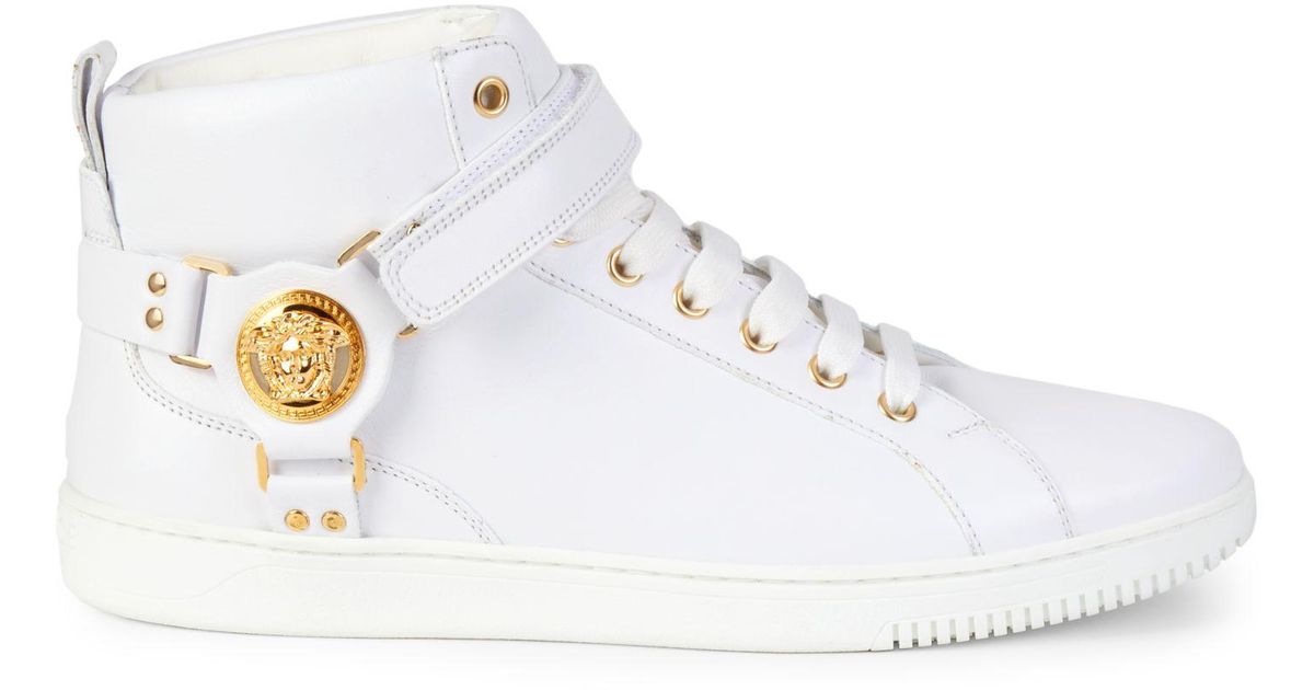 white and gold high top sneakers
