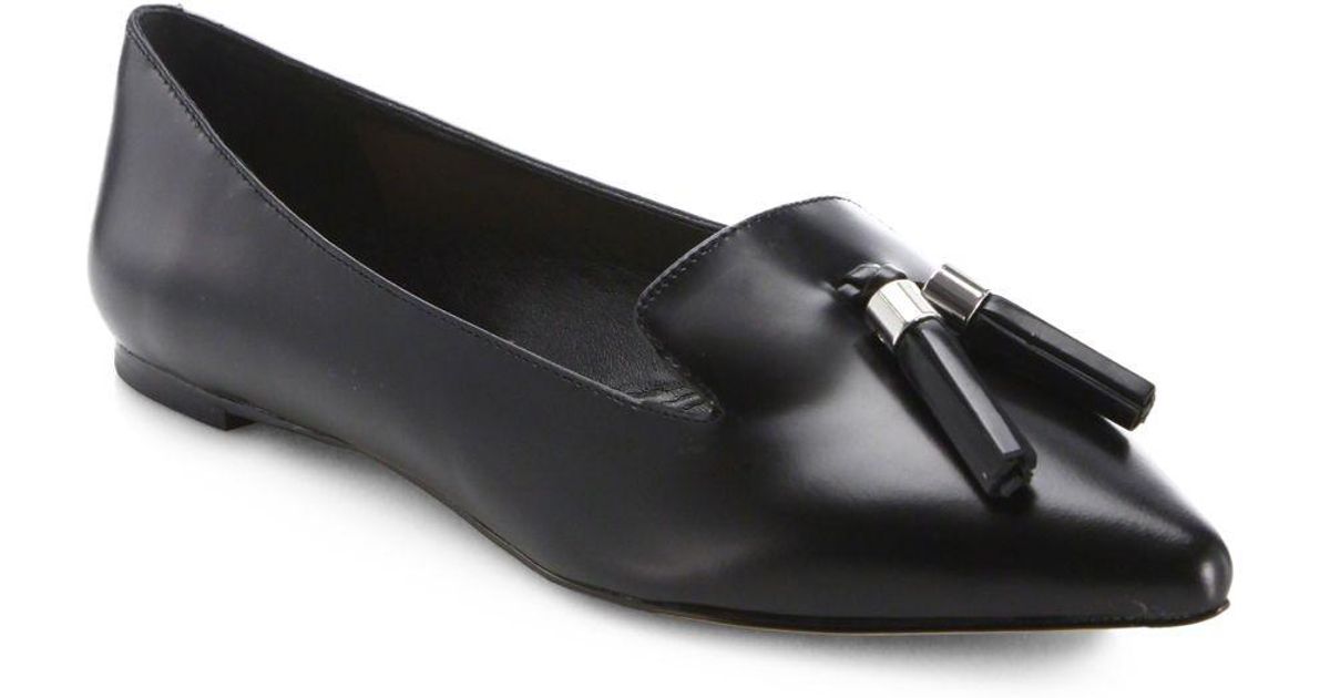 black flats with tassels