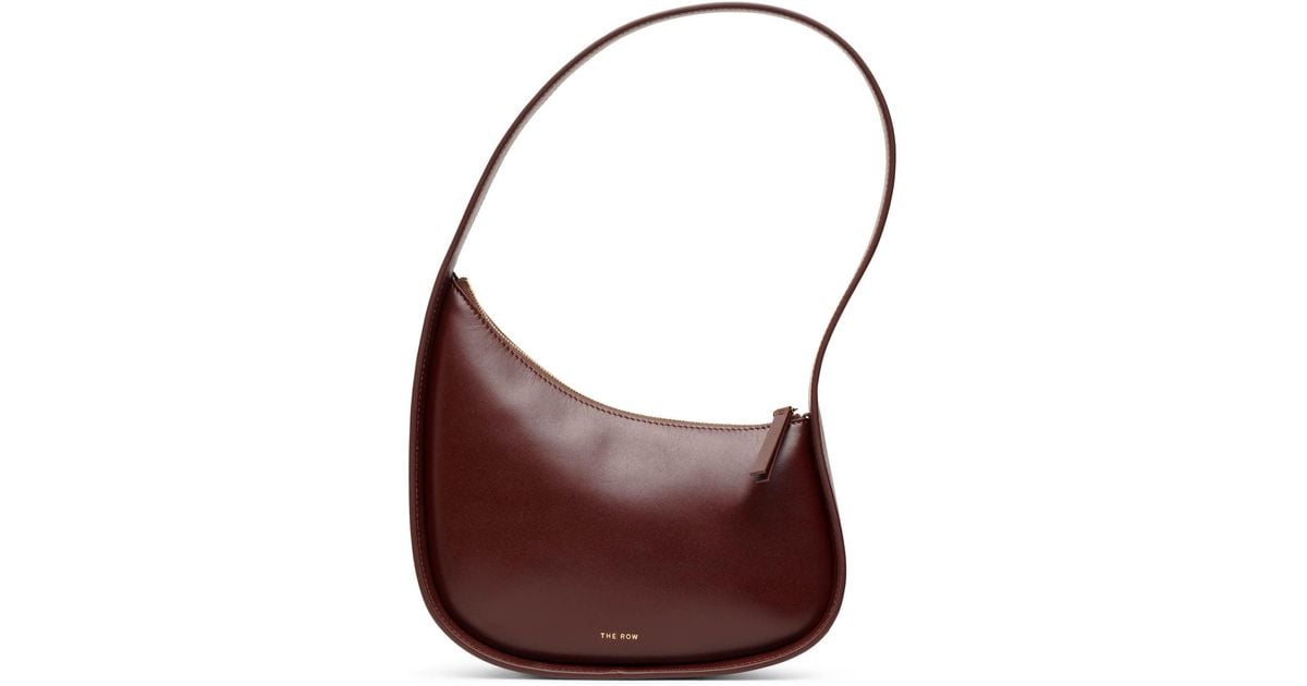 The Row Half Moon Bourbon Leather Shoulder Bag in Purple | Lyst