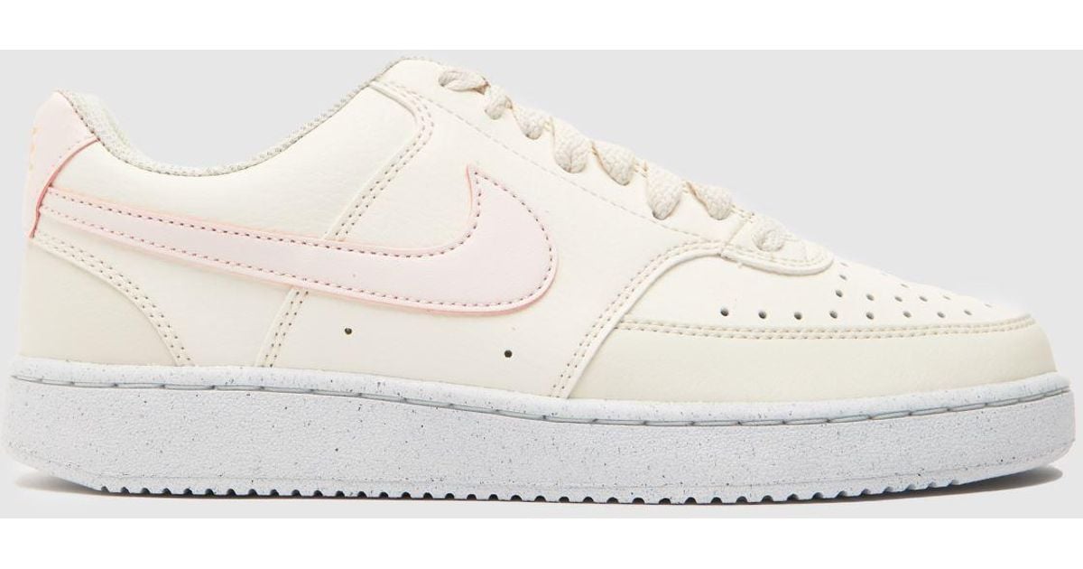 white and pink court vision trainers