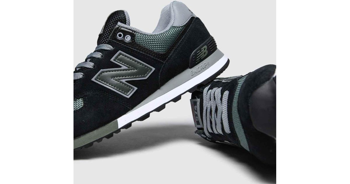 black & green 574 trainers