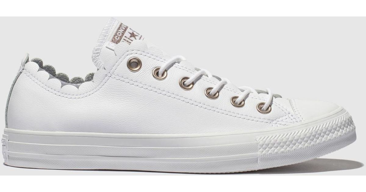 white frilly converse