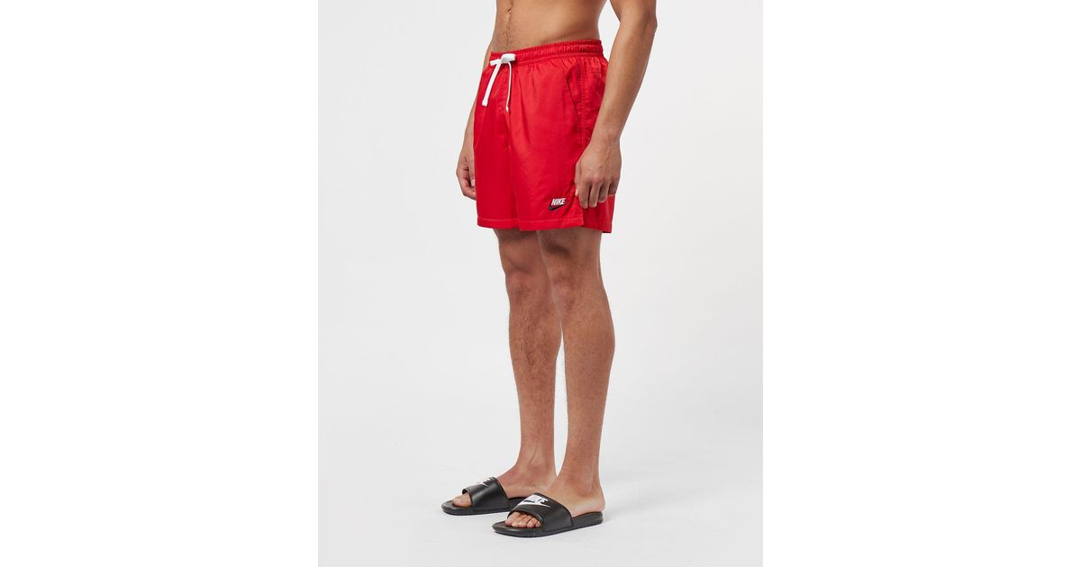 red nike woven shorts