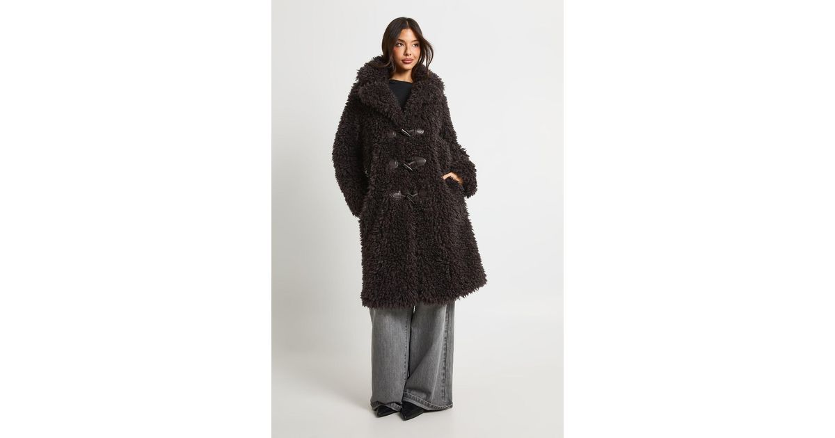 Boohoo Shaggy Fur Toggle Front Longline Coat in Black | Lyst UK
