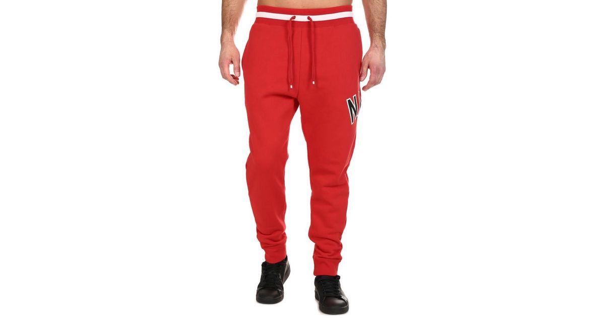 white and red nike joggers