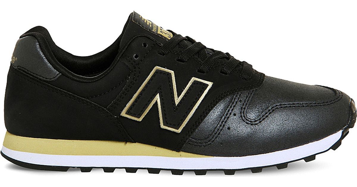 new balance black & gold 373 suede & mesh trainers