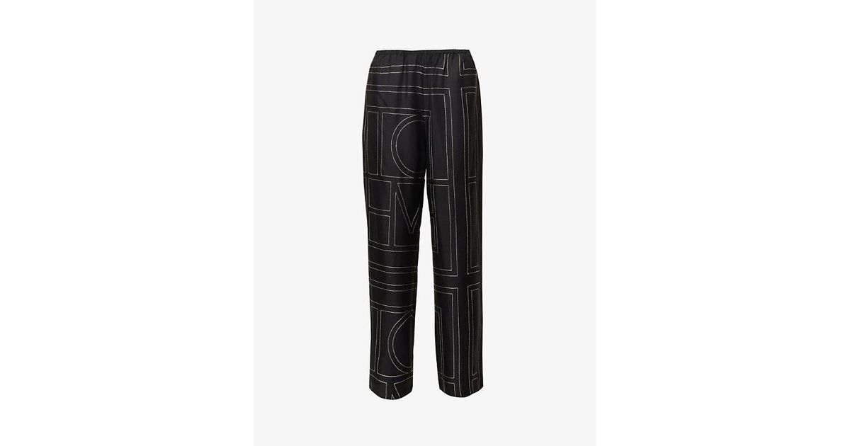 Totême Logo mid-rise silk pants