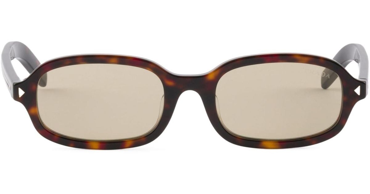 Prada Sunglasses With The Iconic Metal Plaque in White | Lyst