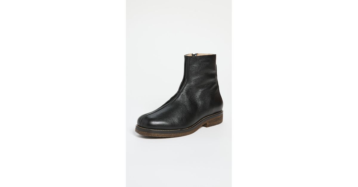https://cdna.lystit.com/1200/630/tr/photos/shopbop/27bdbd81/lemaire-designer-Black-Boots-With-Shearling.jpeg