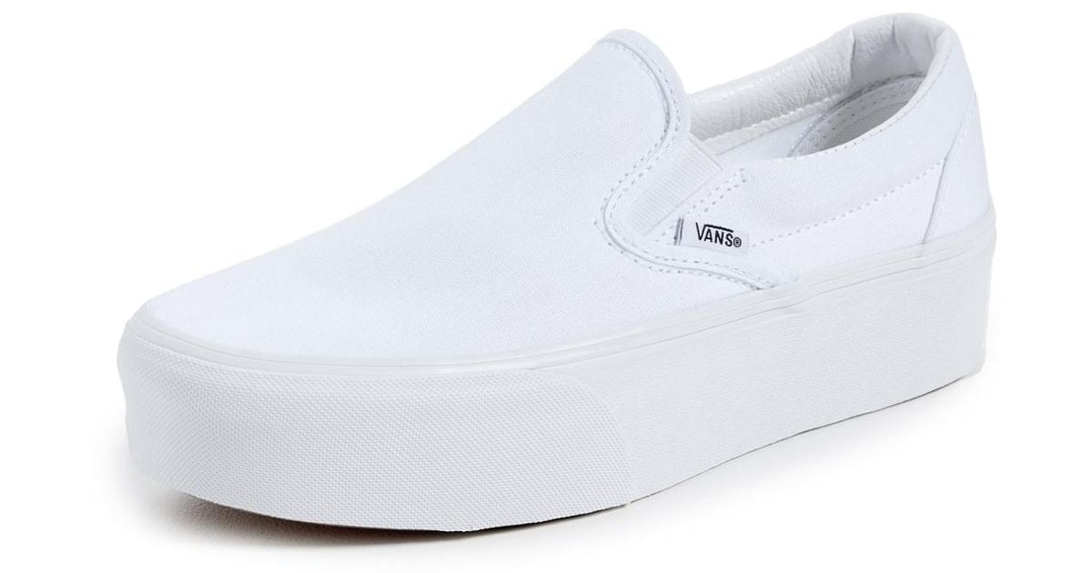 White canvas vans slip best sale on