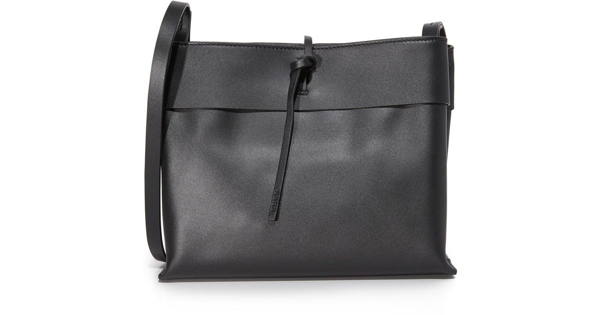 Lyst Kara Tie Cross Body Bag In Black