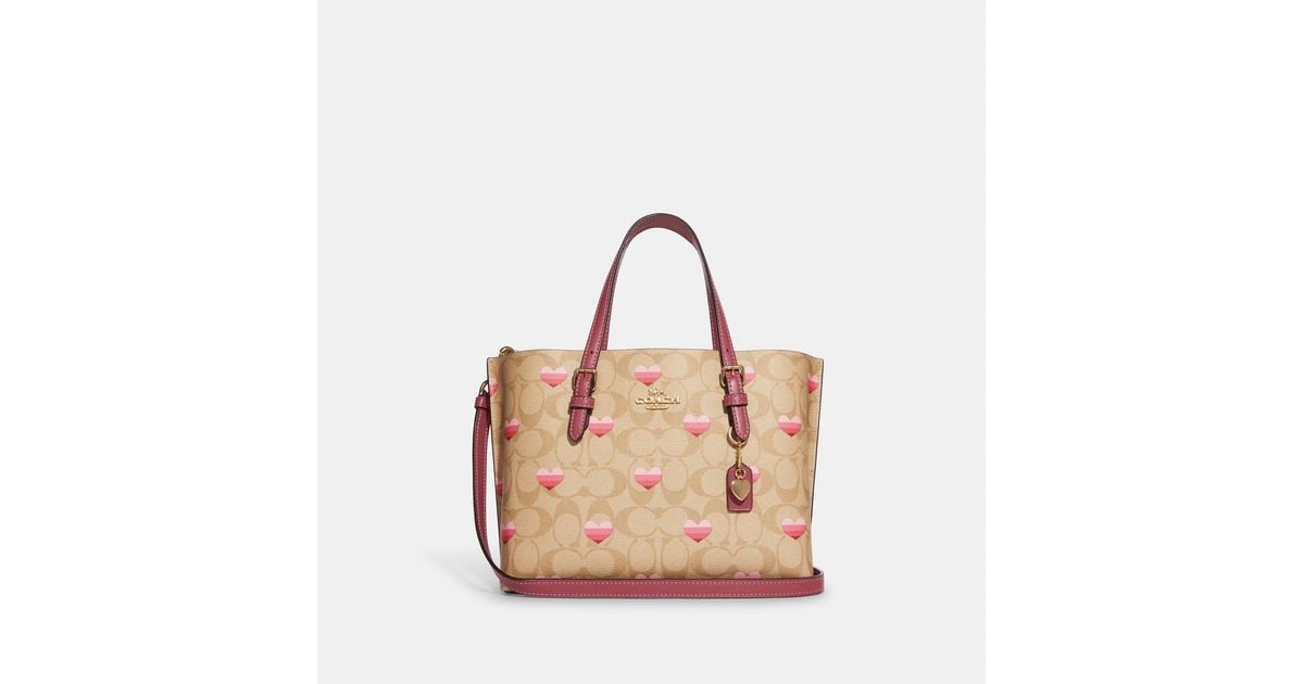 mollie tote 25 in signature canvas with stripe heart print