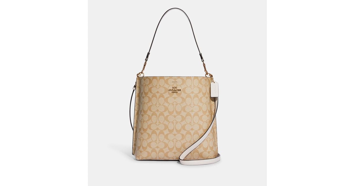 Coach Outlet Mollie Bucket Bag In Signature Canvas in Gold/Light Khaki