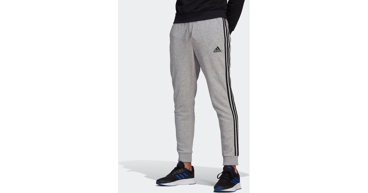 essentials fleece tapered cuff 3 stripes pants