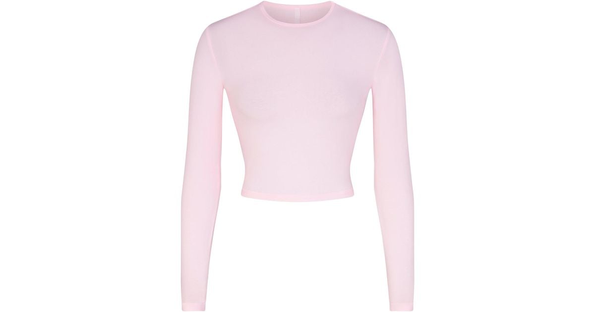 Skims Cropped Long Sleeve T-shirt in Pink